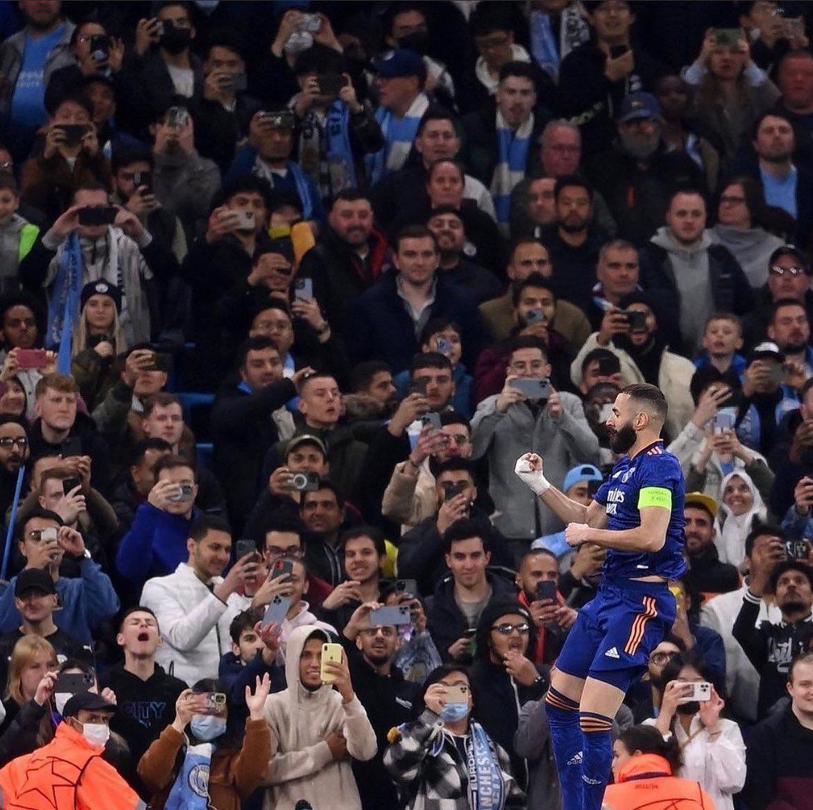 City fans watching Benzema score against them.

Just football fans, enjoying the moment.

Not a phone in sight.