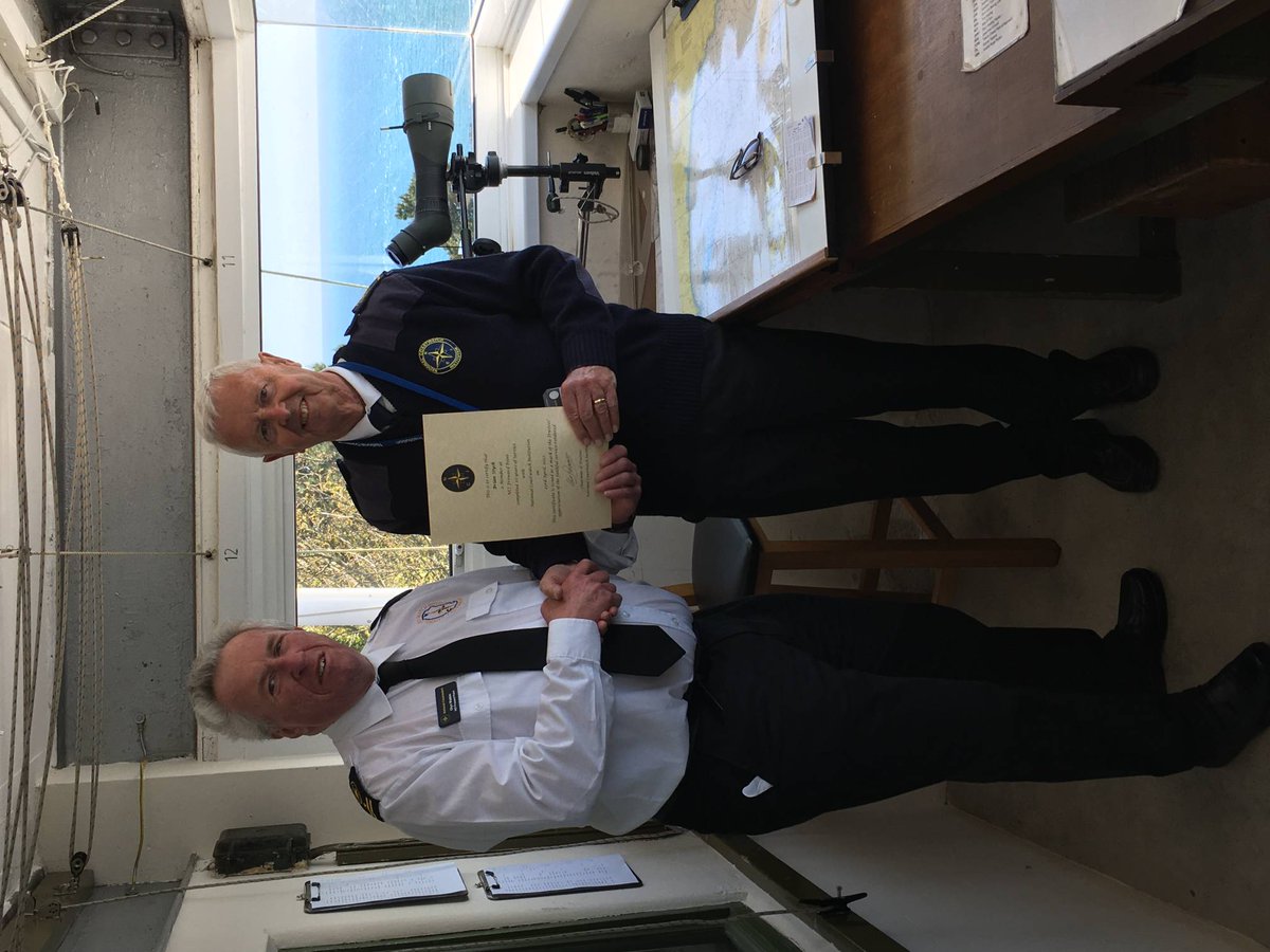 Watch Keeper Brian receiving his 10 year certificate from Station Manager Glyn for voluntary service at NCI Froward Point.