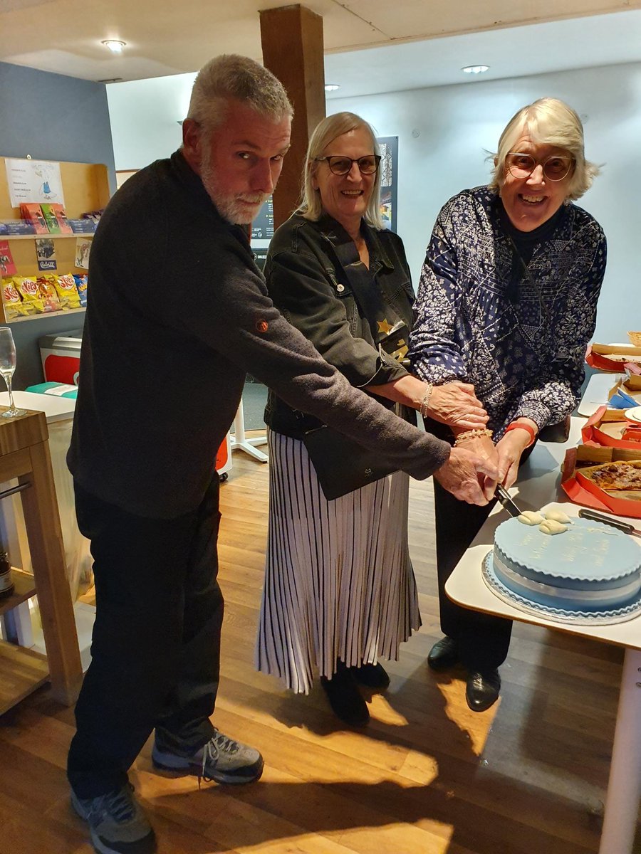 Pizza and a large decorated show cake. The perfect foods for a retirement party say Mick, Sonia and Wendy. Slice of balloon anyone?