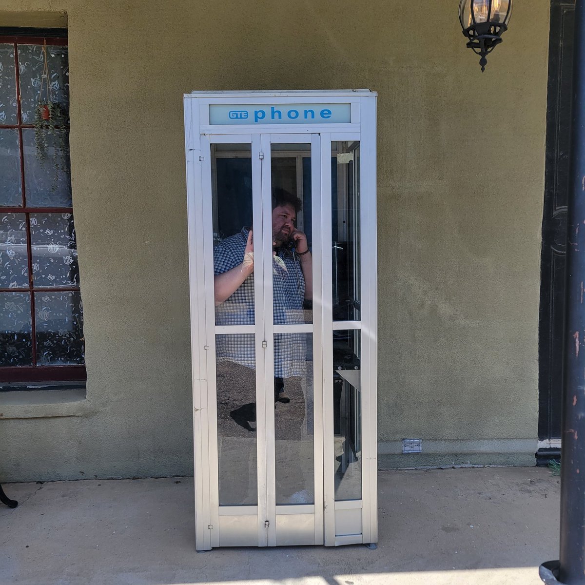CapoJ007's tweet photo. Our favorite coffee-drinking public historian faces his greatest challenge yet. Using a pay phone with no change or dial tone
Image description: A post industrial, post modern, pre information era, contemporary style communication booth
#HistorianInRepose #ExtraShotOfHistory https://t.co/4vQEYuwDVs