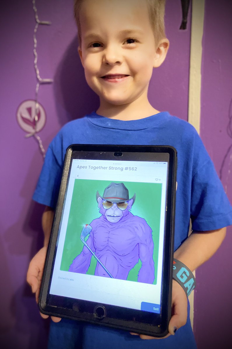 Colt loveing his <a href="/ATSNFT/">Apes Together Strong NFT</a>