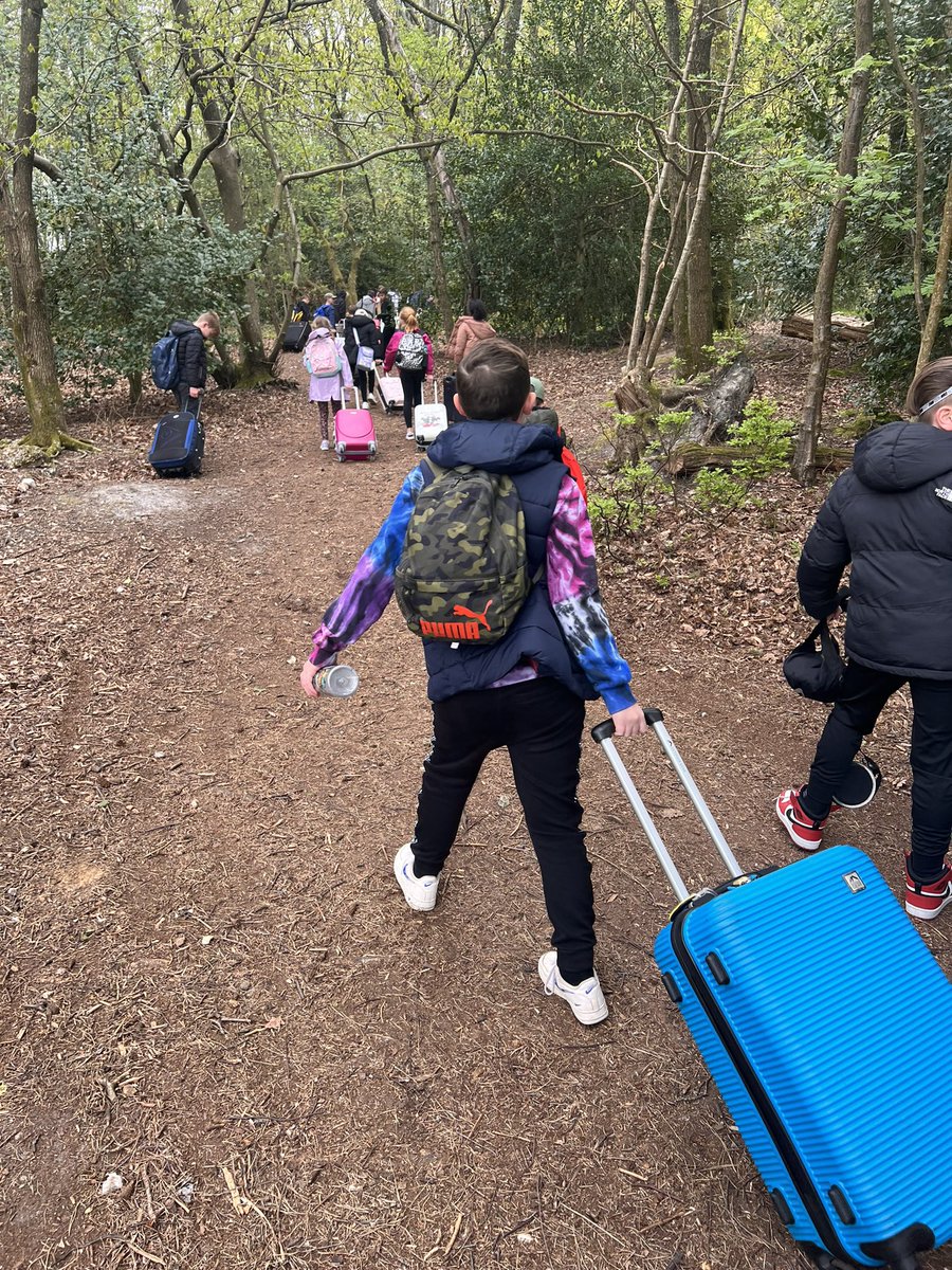 mayplaceprimary's tweet photo. We’re here! We had to trek through the woods with our cases but we made it! Everyone is very excited and ready for FUN! #PGL #adventure #woods #suitcases #lunchtime #mayplace #schooljourney https://t.co/5PxEFsBiyf