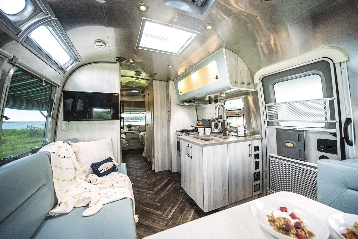Feel like you never left the outdoors when you make it home at the end of the day. ☀️ The International’s design palette is full of cool wood tones and natural textures that create an inspiring, warm space to rest up and wind down from adventure: go.airstream.com/3gPWpko