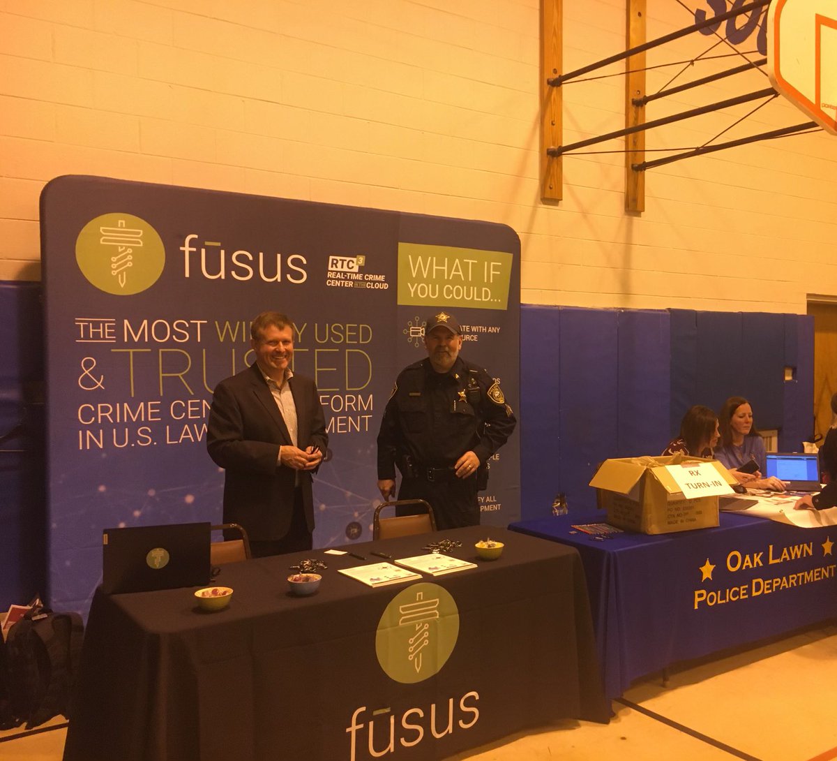 OakLawnPD's tweet photo. Sgt. Schmidt is pulling double duty for the department today. We are collecting prescriptions that are outdated. Also we are working side by side with Jack Howard of Fusus trying to have people register their Ring Doorbells. #OLPD #FUSUS https://t.co/N8ifvyUUkp