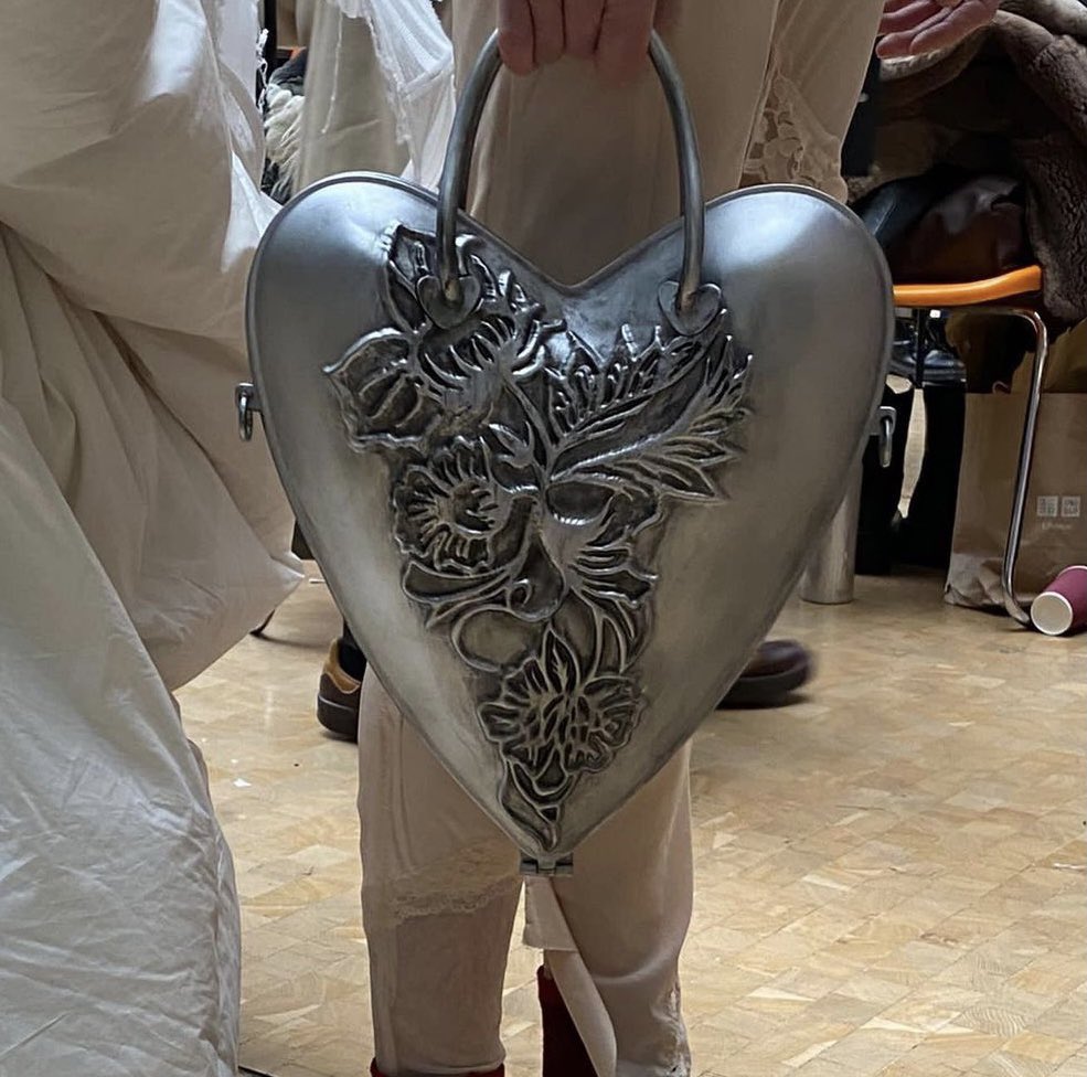 girIsonfiIm's tweet photo. simone rocha fw22 dress + heart bag by joão machado &amp; wai yan choi + locket braclet from the 1940s https://t.co/sA8hcCcyae
