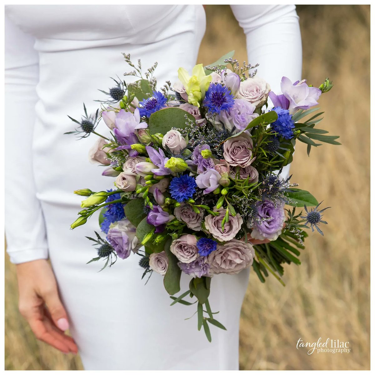 Tangled_Lilac's tweet photo. It's #WeddingWednesday and gosh I love wedding bouquets.   What colors did you use for your wedding? Or if you're getting married, what will you use?   It's no surprise our wedding color was purple 💜 https://t.co/7cZKOnITJ9