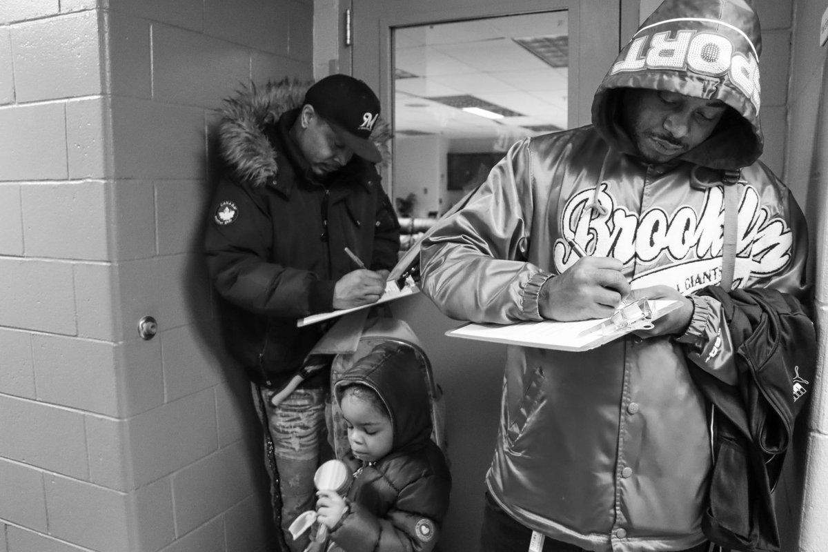 Next Door: Picture of the Week 

What we see every day. 
Present and engaged dads taking care of their kids. 
Yes, that includes filling out pesky but important paperwork.