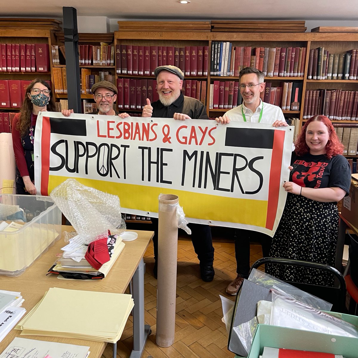 BishopsgateInst's tweet photo. I think you can tell by our faces that we're absolutely thrilled to provide a home to the beautiful reproduction/treasure of the original Lesbians &amp; Gays Support the Miners banner, donated today in #LGBTQ+ #archives @BishopsgateInst by the wonderful Mike Jackson of @LGSMpride https://t.co/P2MyirvWAL