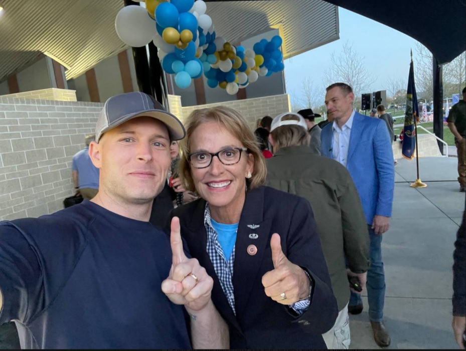 RightWingWatch's tweet photo. Arizona state Sen. Wendy Rogers looks very happy to be hanging out with white nationalist Vincent James who, just one day earlier, was openly advocating throwing gay people of the roof of buildings. https://t.co/OYueh9eV2e