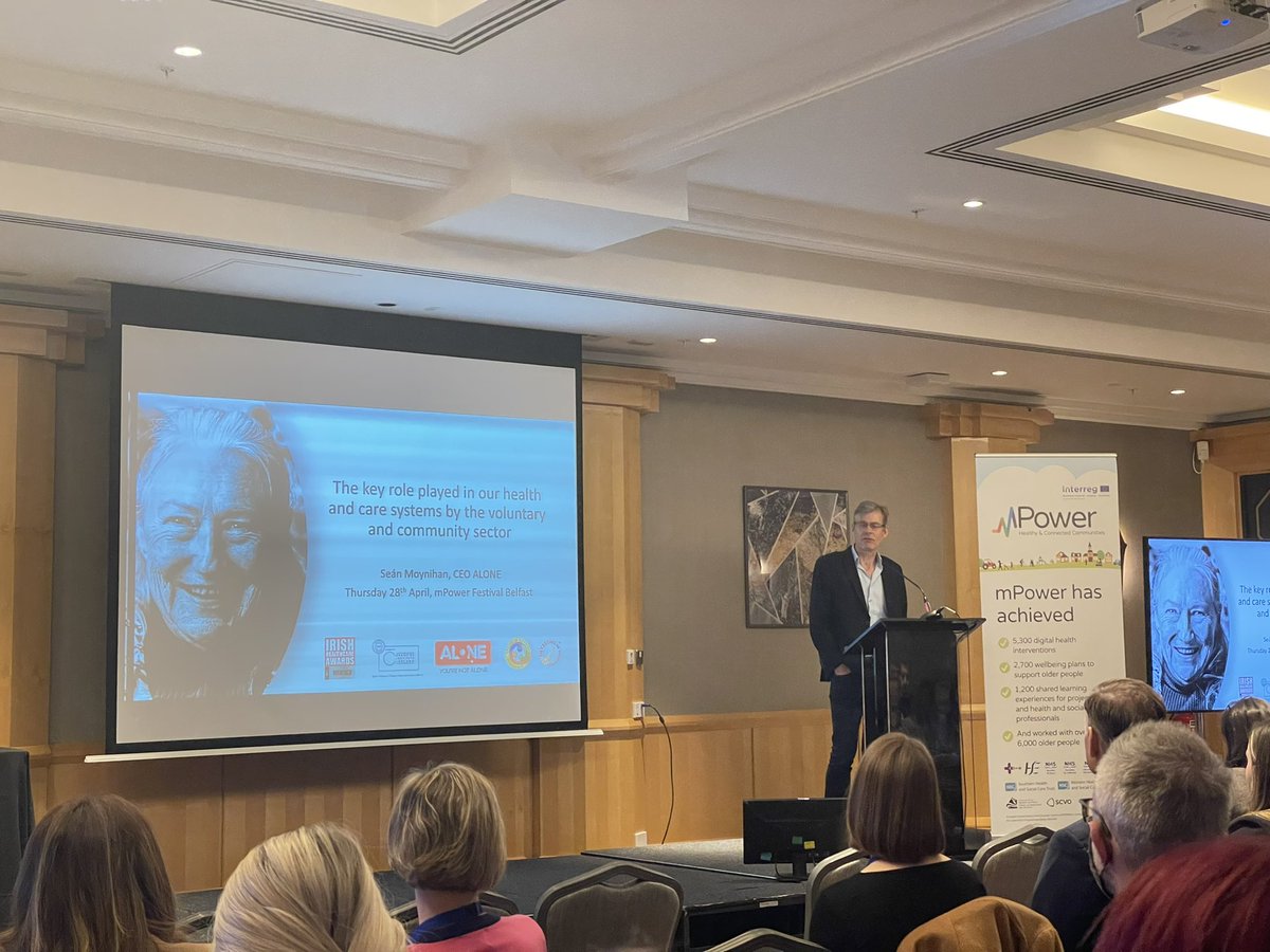 KTM_DigiHealth's tweet photo. @SeanMoynihan_ from @ALONE_IRELAND providing the keynote speech at day 2 of the #mPowerFestival outlining the excellent work undertaken by @ALONE_IRELAND in collaboration with mPower, the HSE &amp; voluntary and community orgs to support older people in Ireland. https://t.co/PAYxE8VaPz