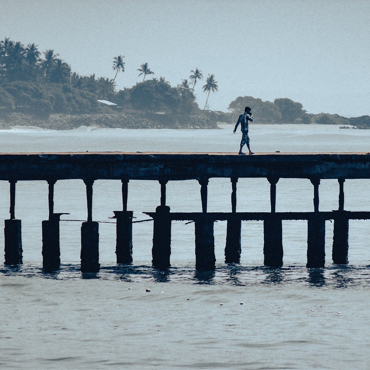 Gypsyshutter's tweet image. A man talking over phone and smoking while walking over the Thalassery Pier.
#gypsyshutter
.
.
.
#travelphotography #traveling #travel #wanderlust #yourshotphotographer #NFTCommmunity #NFTphotograph