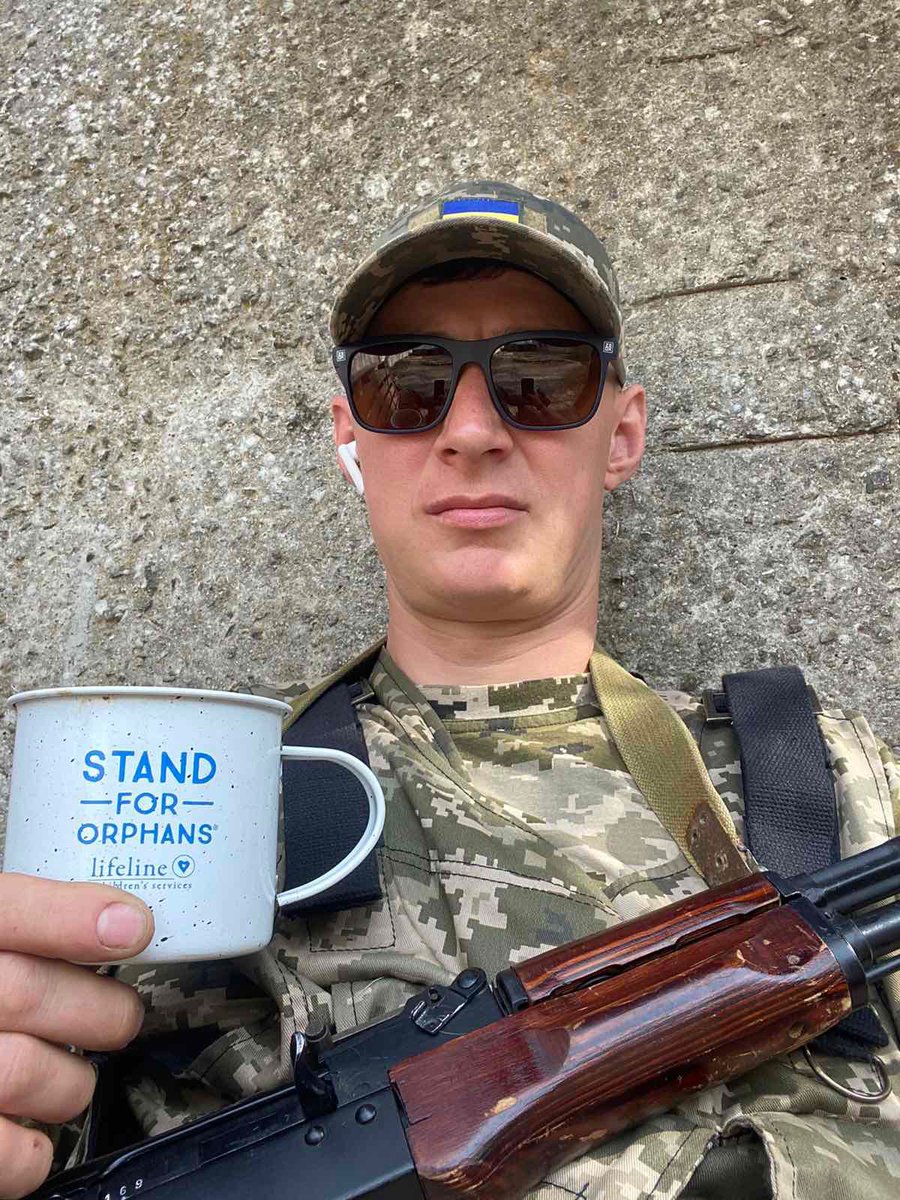 Hmnewell's tweet photo. Ukrainian soldier taking a legitimate #standfororphans. Grateful that @LifelineChild has had the opportunity to serve those helping orphans caught in the line of fire during this Russian invasion. Please help us Stand for Orphans today. https://t.co/UA0lDzPGQR https://t.co/aRzws3bga1