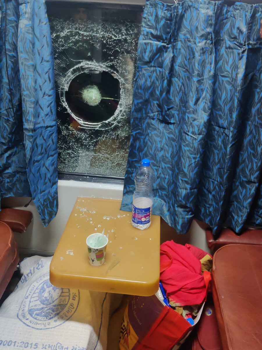 Ndahima's tweet photo. @IRCTCofficial @indianrail #Train16210 window hit by a big stone from outside! Two kids and family just got saved luckily!!! Such a shameful act! Incident happened just before the train reached Tumkuru station! https://t.co/IqD41g9GpL