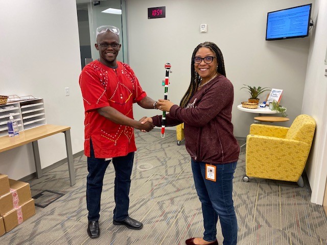 In Maasai culture, the Rungu is an important emblem of warrior status. David, who is from Kenya, passes the ceremonial Rungu to Angell. “Thank you for your leadership and courage in supporting the company’s strategic diversity initiatives” #diversitymonth