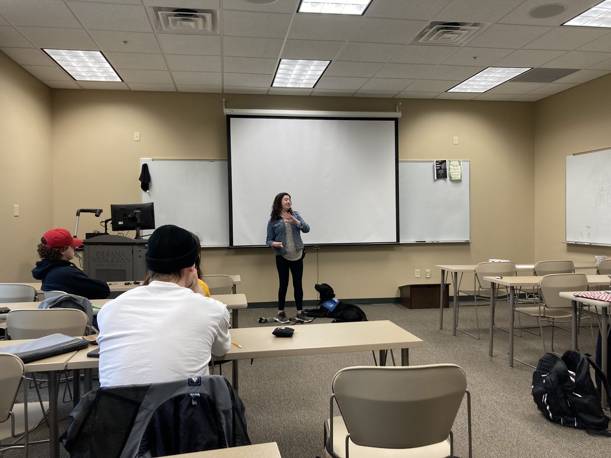 IWUcom's tweet image. Vada Hornocker, an Indiana Canine Assistant Network volunteer, spoke to Intro to Newswriting. Hornocker has been volunteering with ICAN for six years and today she spoke on training service dogs and introduced the class to Max, a dog in training. #ICAN #servicedogs #iwu #sojourn