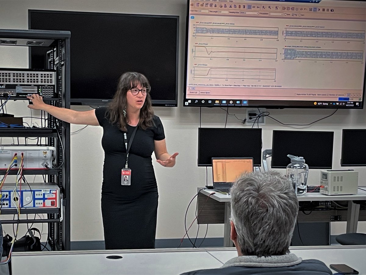 PWREngineers's tweet photo. Engineer Becca Avery explains the OPAL-RT’s function for hardware-in-the-loop testing during a tour of POWERs' Advanced Technology Lab for attendees of @NWPPAssoc IT conference held in Boise this week. #utilities https://t.co/5FVw9e0fWV