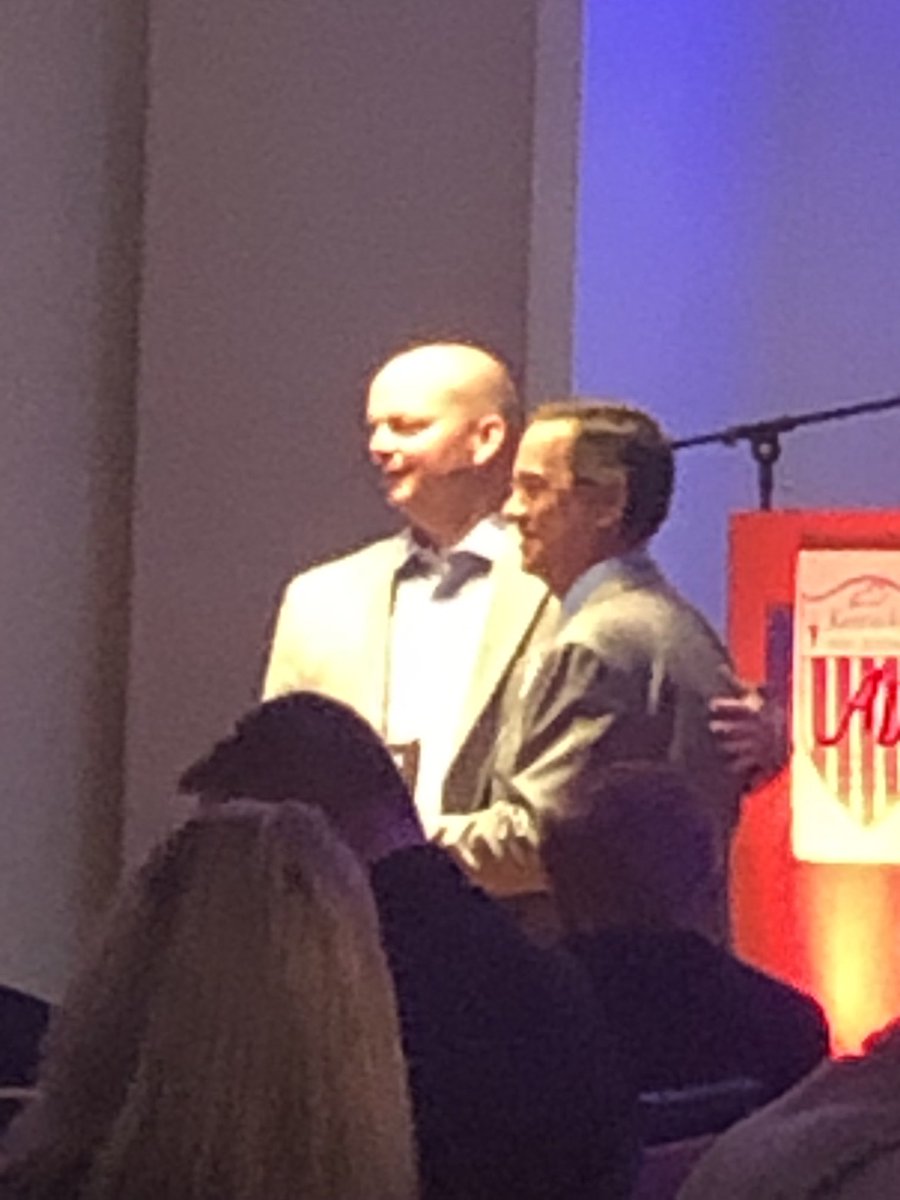 Todd Harper receives the third region AD of the year award.