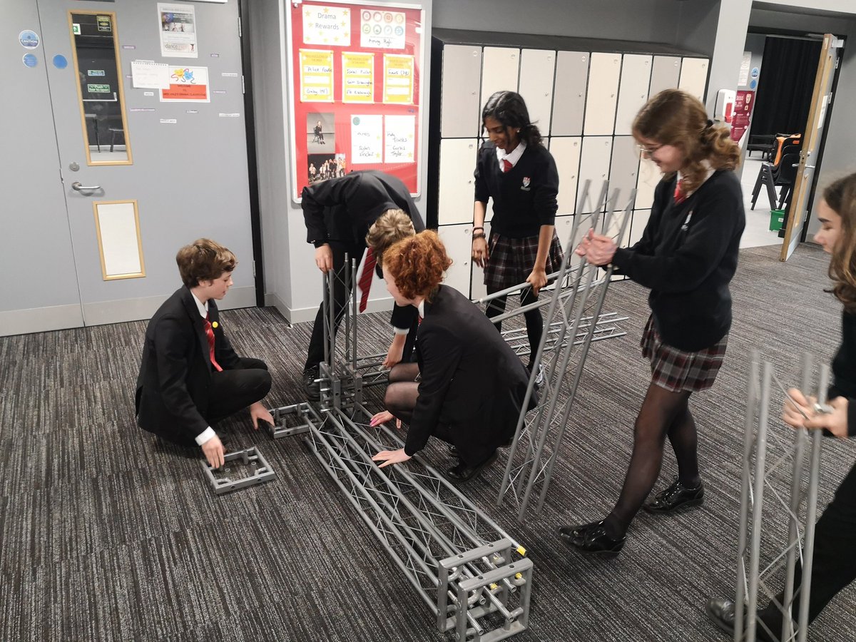 Stage crew building the set. To me, to you.