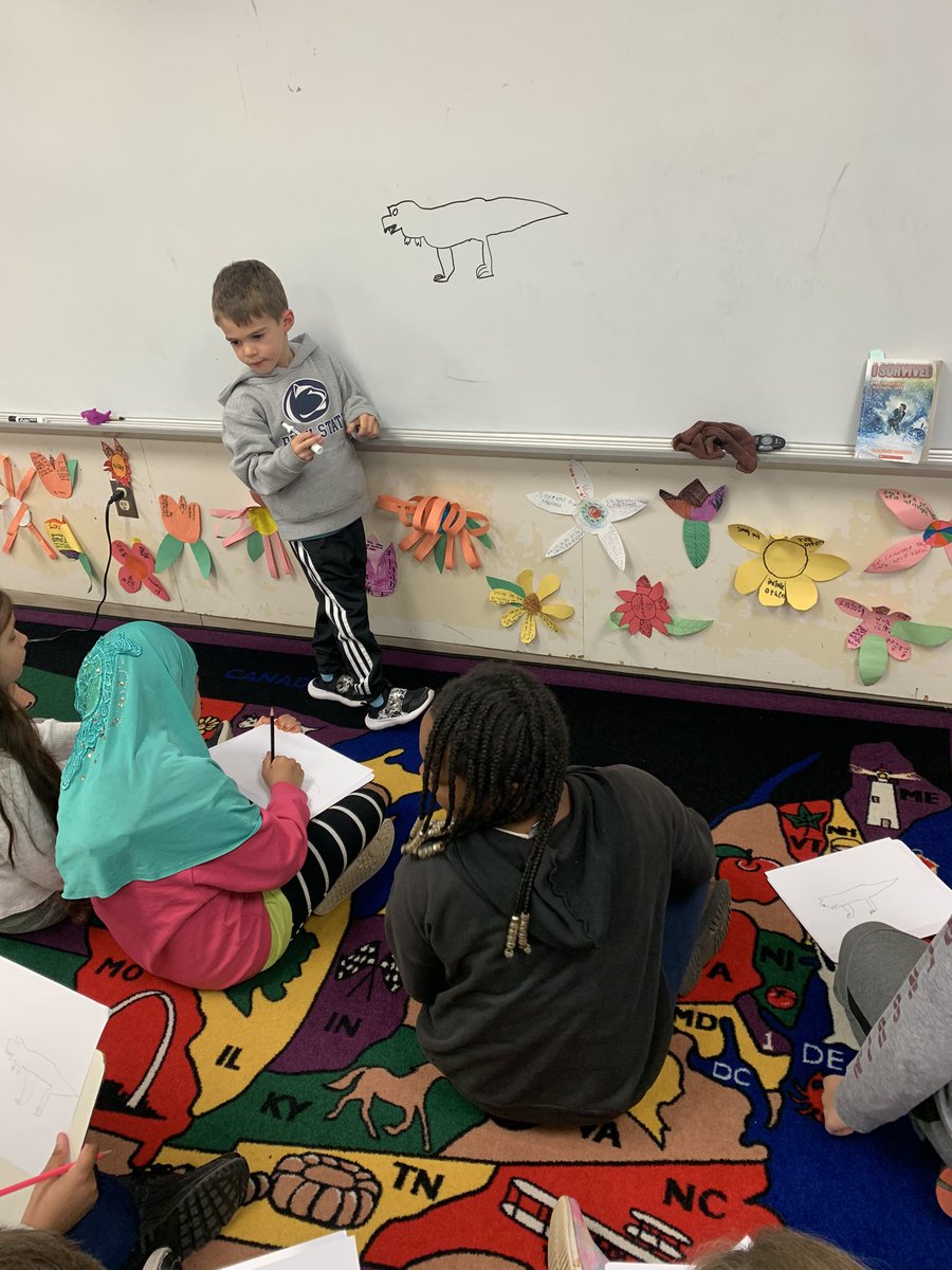 LaurieCorrNPSD's tweet photo. I think it’s safe to say that Aidan LOVED being an #OPshark today and is going to miss all of his new friends! He played math games, went to music, ate in the cafeteria, did buddy reading, and even led a lesson on how to draw a dinosaur.👏🦈 #TakeYourChildToWorkDay https://t.co/64SdCW99jO