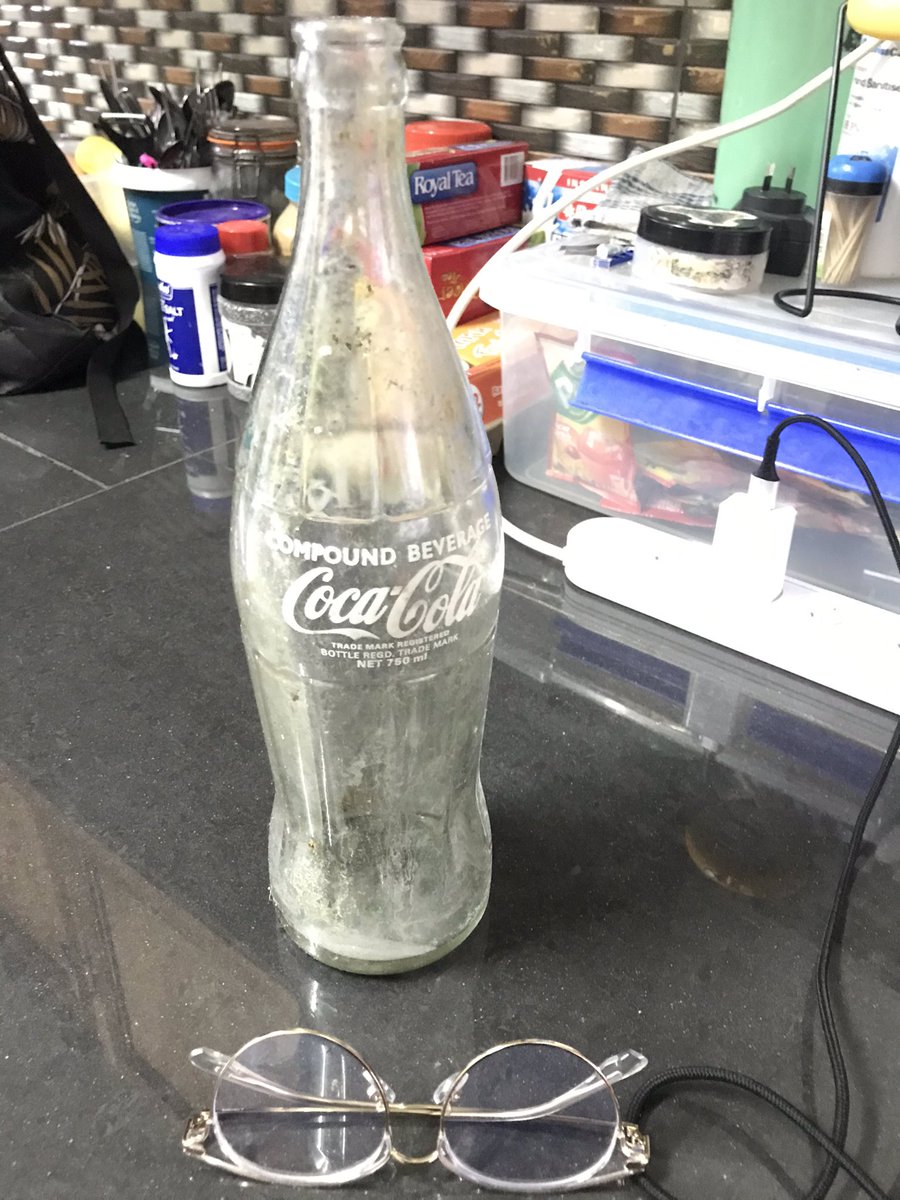 the_psammite's tweet photo. So, I found this 750ml Coca Cola glass bottle when we went with @bubblefaio up Korobabā for #AdventureWithAPurpose and I think it could at least be 28yrs old. I may be wrong
(glasses for scale) https://t.co/hF63jnlmDw