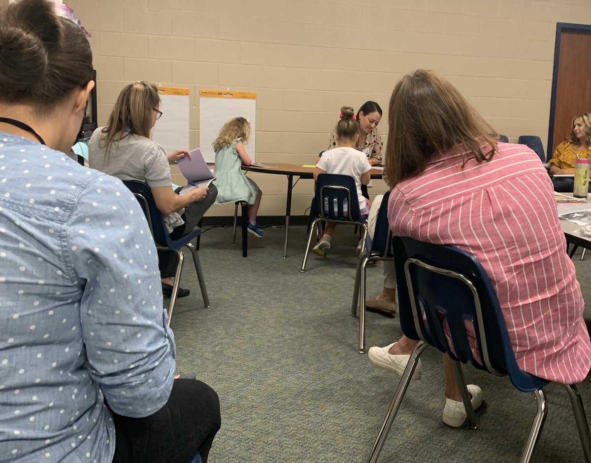 Teachers at Birnham Woods Elementary watch Anna Carreno fishbowl a guided reading lesson with kindergartners.