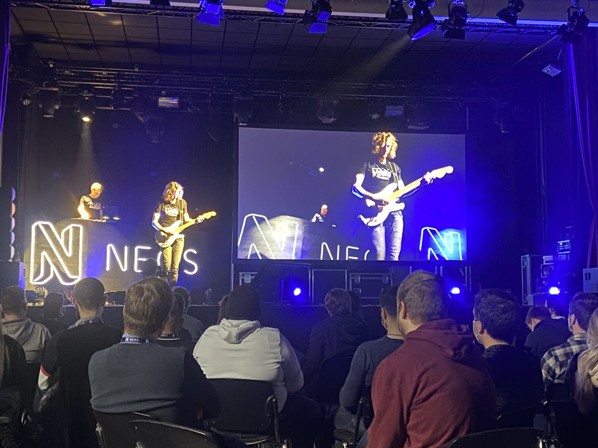 The four hosts for the upcoming two days open the #neoscon.

Awesome to be back and nice to have the live music between the talks.