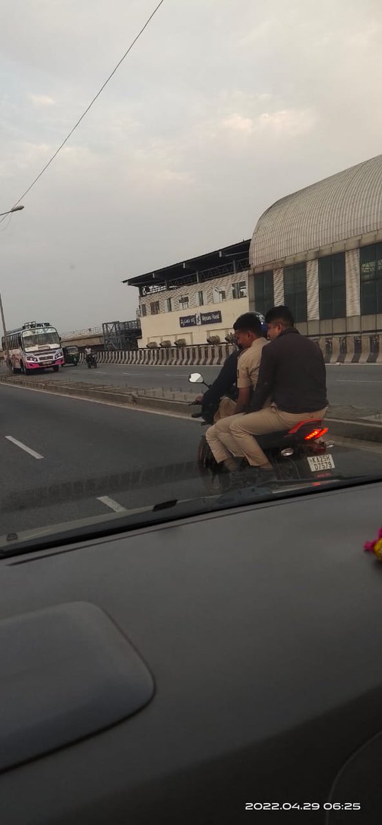 arun150984's tweet photo. No helmet, riding 3 men on one bike on nayandahalli fly over. Can we expect some justice? @BlrCityPolice https://t.co/YRSlQwgMzo