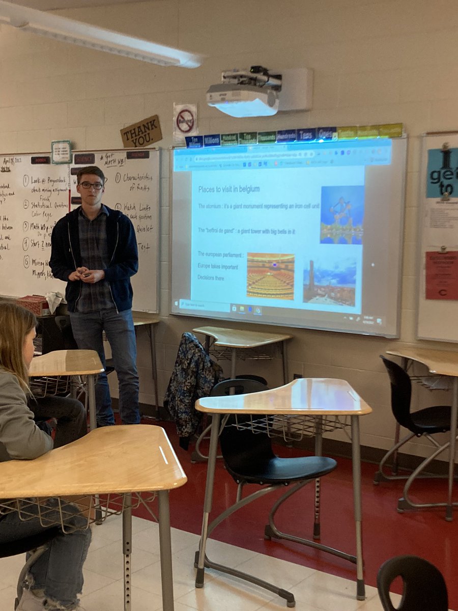 Cville_AFS_Club's tweet photo. Femi from Sierra Leone, Victor from Belgium and Maribel from Ghana present to 6th graders at CMS while one of the students holds money from Ghana. https://t.co/qjcaji7vvg