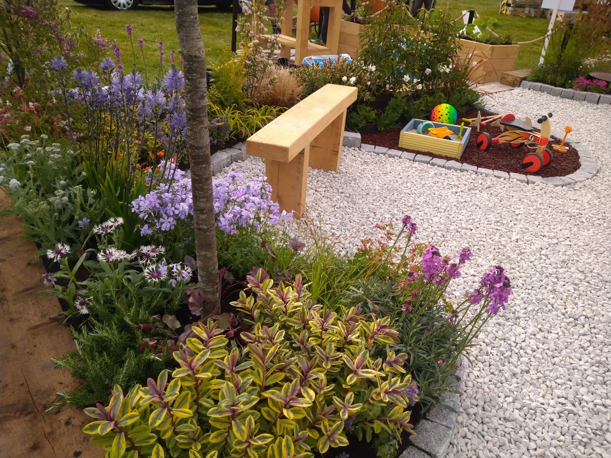 OSTCharity's tweet photo. #HopeStreet Garden at BBC Gardeners' World #SpringFair is ready🌺! Huge thanks to Tim, Martin, Eliot and Rob from Tab Landscapes for all their hard work. Please visit from today - 1 May. Info here➡️https://t.co/x5dWj3AKh7 #BBCGWSpringFair #GardenInspiration #Traumainformeddesign https://t.co/INKS30nqsE