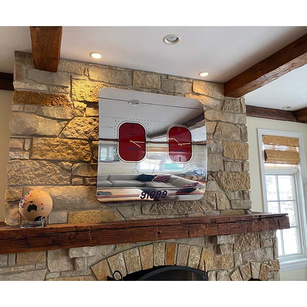 Boeing Fuselage section hanging over the fireplace in it's new home in the USA. 
A candy red powder coated frame married with a custom vinyl applied to the front of the fuselage and the clock faces. 
Love the final result of this piece.
#avgeek #aviation #aircraft #boeing