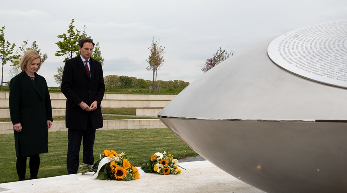 Minister Truss left and Minister right in front of the memorial. They just laid flowers on the monument.
