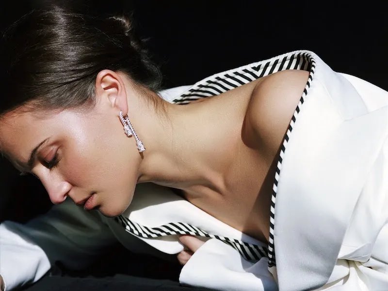 alicia vikander says the pandemic was “a chance for my husband and me to be at home, just cooking. we worked and we met up with five other families on zoom and worked out monday to friday together. In my little family, with my husband and my child, we travel together, always.”