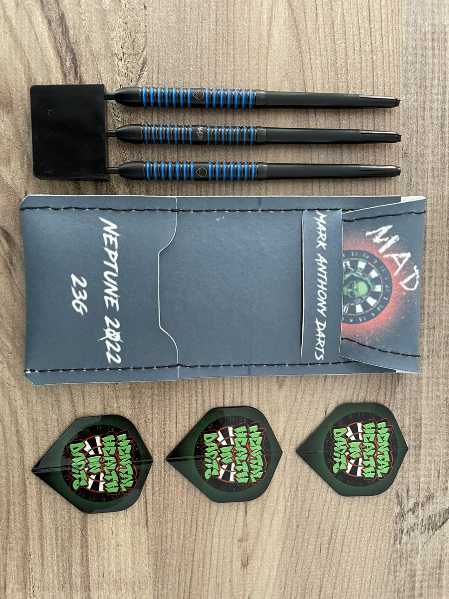 MentalDarts's tweet photo. Wow, that’s a surprise to come home too 👀

@MarkADarts have sent us a set of their personalised darts to raffle off for charity 🎯

I love the MHiD flights they have made as well 💚 https://t.co/wEhwAZeniq