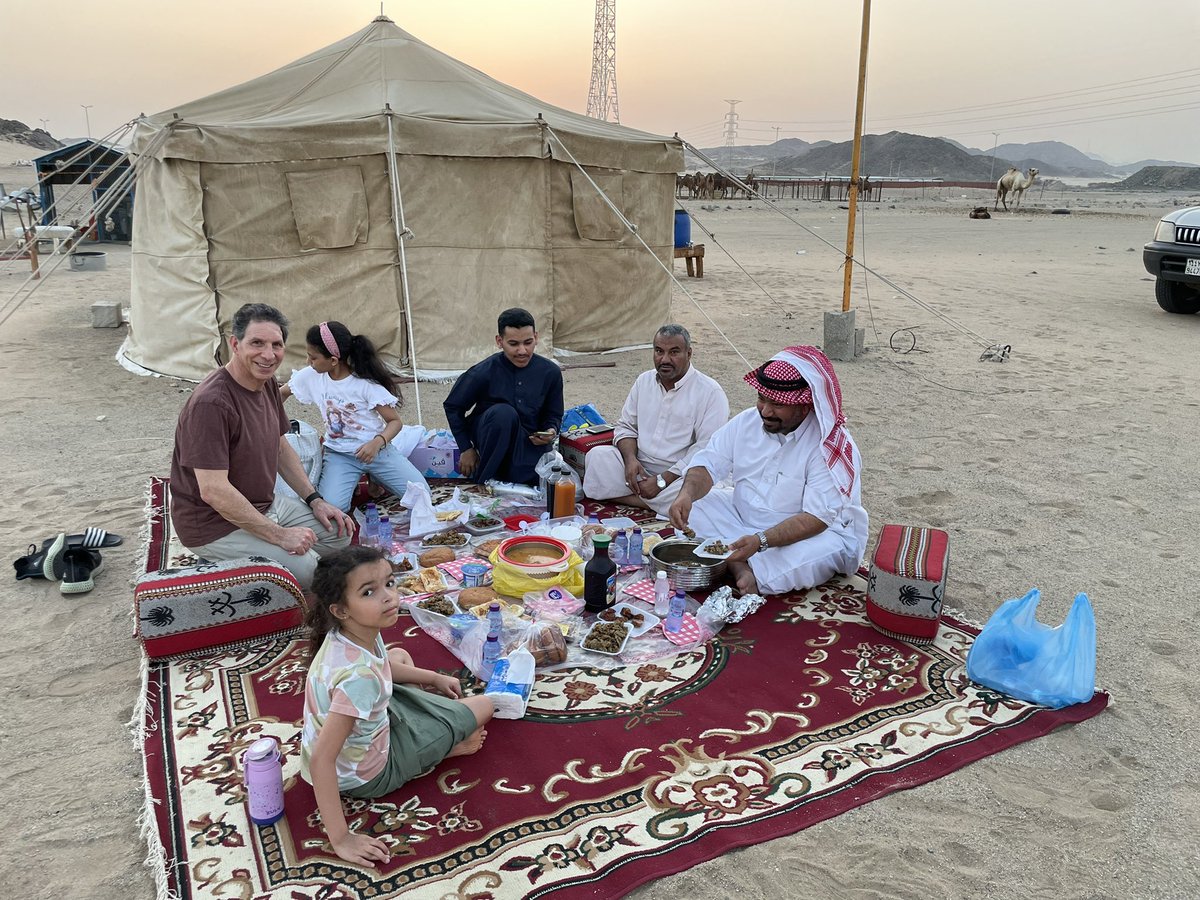 Ironcoaching's tweet photo. A true #Bedouin experience in the desert of #SaudiArabia with my son, granddaughter and a few new friends and their camels. First time tasting camel’s milk. https://t.co/Hu4K0RqJBe