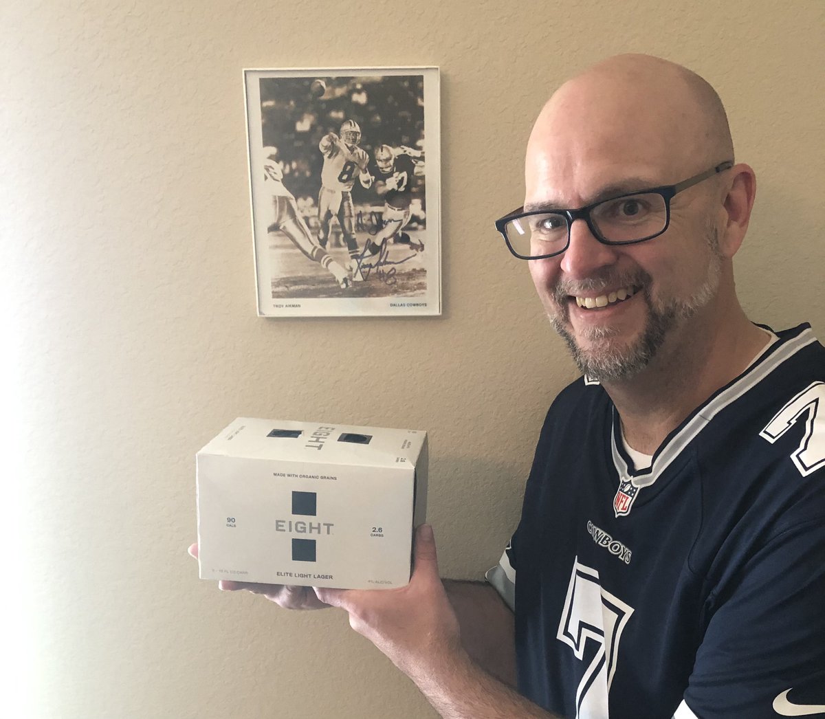 TheRealLiveBigJ's tweet photo. Hey @TroyAikman, I’ve been sober for nearly ten years, but I made an addition to my Cowboys collection today. I got the pic in ‘89, might be your first NFL promo, and it’s hand signed to me. Won’t be drinking it, but very cool yo look at! #EightBeer https://t.co/cjrfqGyRVK