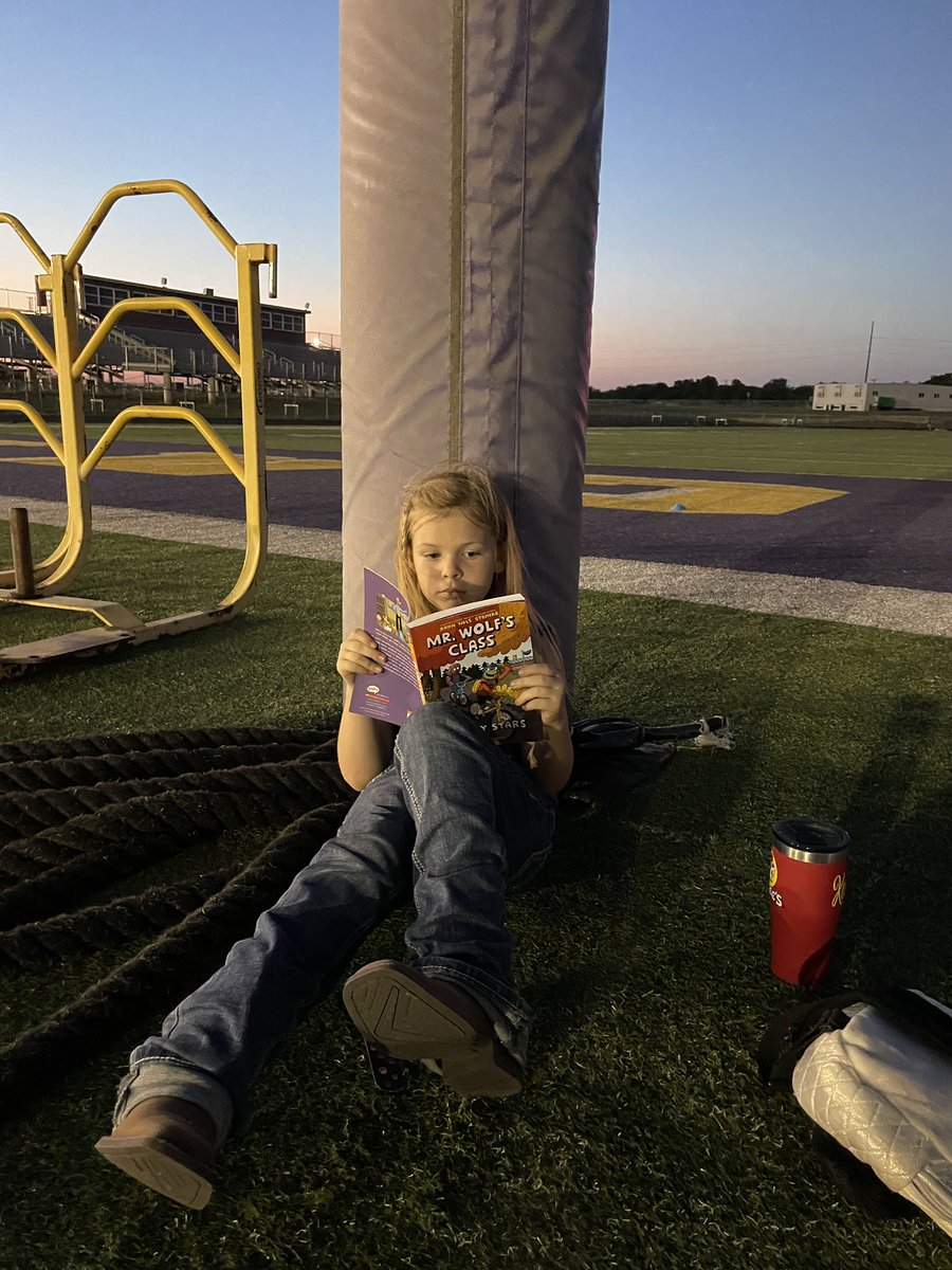 My niece, Saige, found a cozy spot to read at the baseball game in Godly. #Alvaradoreads #AlvaradoExcellence <a href="/AlvaradoSouth/">Alvarado Elementary South</a>