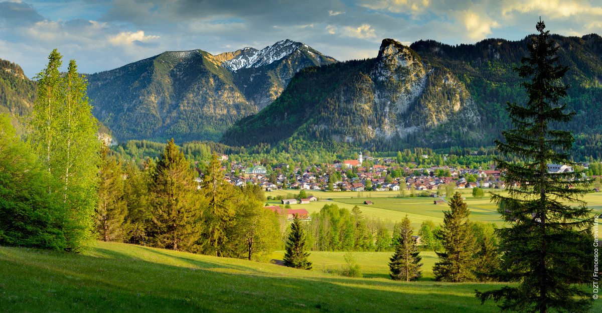 Oberammergau is situated in the middle of the Ammergau Alps Nature Park - about an hour south of Munich, between the Zugspitze mountain and Neuschwanstein Castle. Visitors find both in the nature park: a breathtaking mountain world and cultural sights. #gtm22