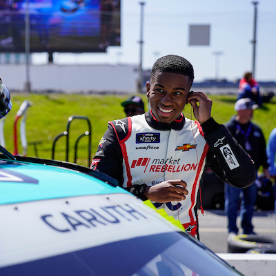 circle's tweet photo. From the classroom at his #HBCU @WSSURAMS on the weekdays, to reaching 200mph on Saturdays. @rajahcaruth_ is one of a kind! We are proud to sponsor his #44 car in today's @NASCAR_xfinity race at @monstermile https://t.co/QsS5WOxukm