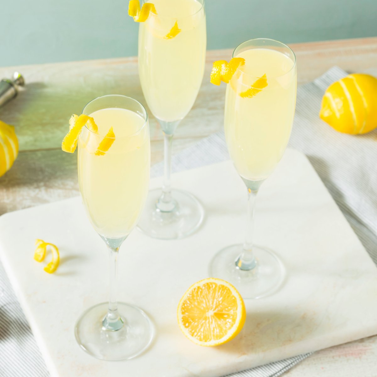 This Lemondrop Mimosa is simply the zest! Amp up your grandma’s lemonade recipe with sparkling wine and lemonade-flavored vodka. Perfect for front-porch sipping and entertaining! #cocktail #mimosa