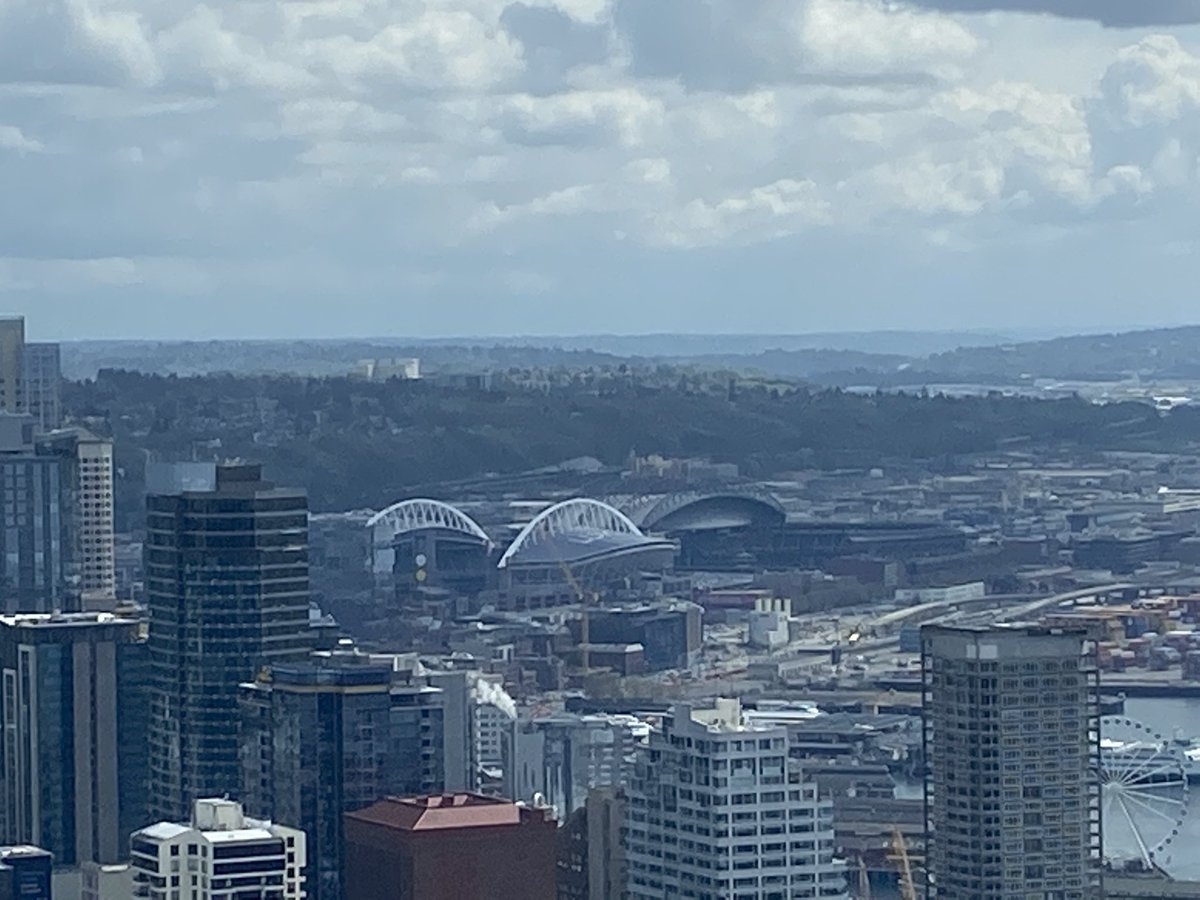 DodgerKnight's tweet photo. On my first ever visit to the @space_needle in 1999, a white dome stood where you see those 2 white arches. And the roof at @TMobilePark was closed so I could see the arches on the @Mariners home. #SJS24 #SJSharks #SeaKraken #Seahawks #Sounders #SeaUsRise https://t.co/NWvIvHB39i