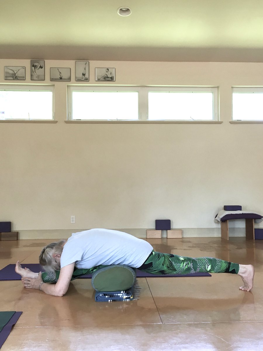 Adho Mukha Hanumanasana: Devon uses the blanket and bolster to help square the hips. Keep the midlines of the thighs straight--don't rotate the legs. And remember that Hanuman is the Lord of Prana; find the pose, then explore your breath. #IyengarYoga #YogaWithProps #Hanumanasana