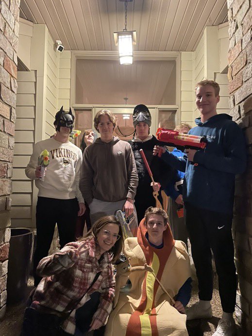 Griffin who is hidden behind batman in this picture was behind the killing of Thomas. There’s a lot going on in this image…. A Hotdog, lovely mother, and a gorilla with a war mask. Odd group of kids