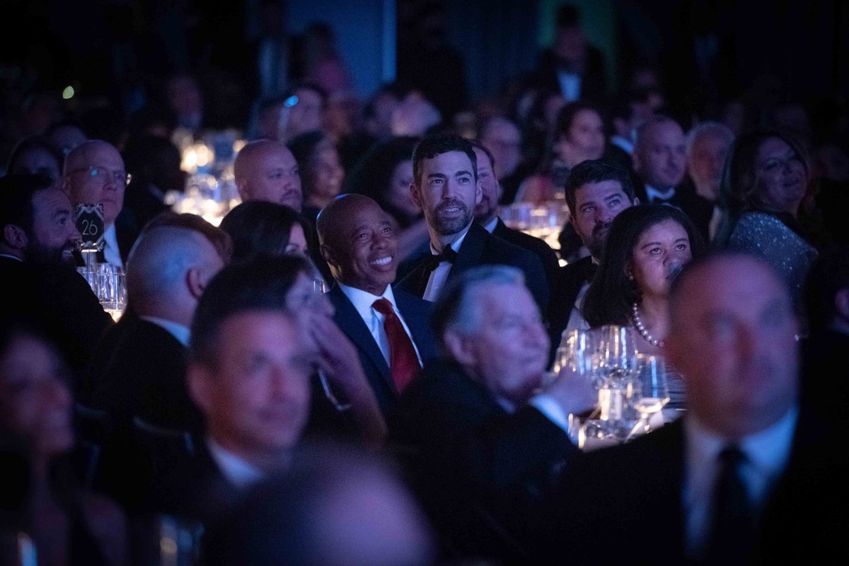 Mayor Adams views the Inner Circle from a packed audience.