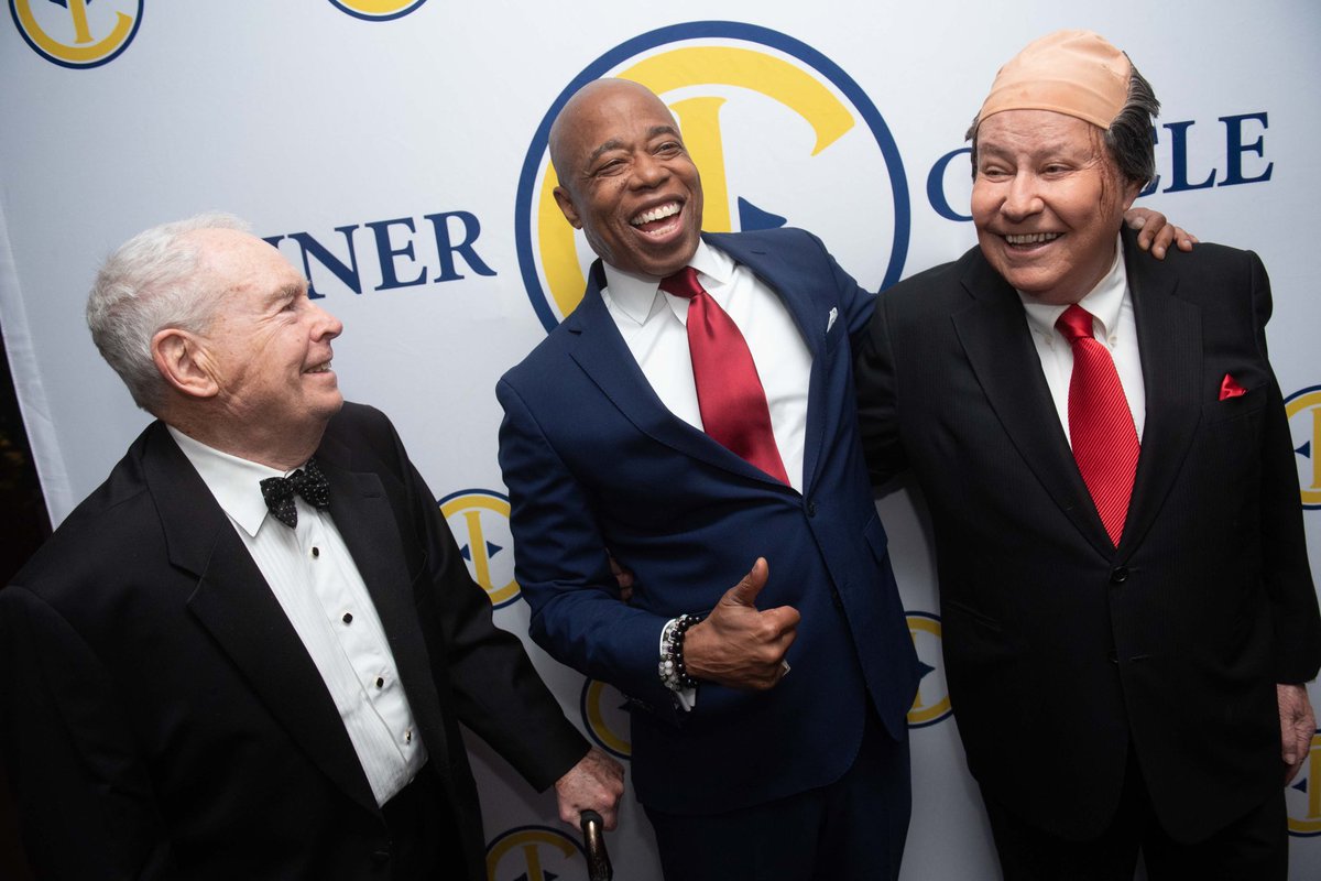 Mayor Adams poses for the camera with two Inner Circle cast members.