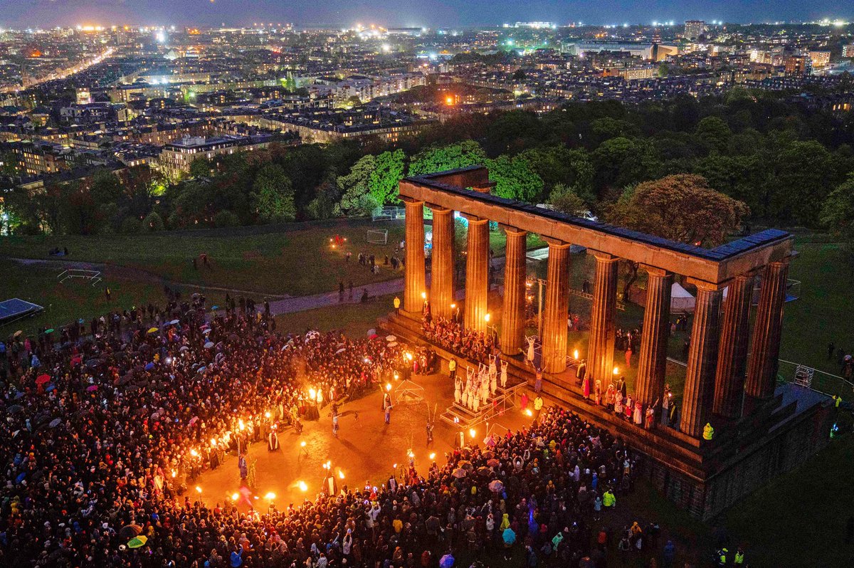 Performers and spectators gather around the National Monument at the start of the Beltane Fire Festival in Edinburgh. An ancient Celtic celebration of the return of summer the festival is centered around the story of the May Queen and the Green Man🔥#Beltane2022 #MayDay #Scotland