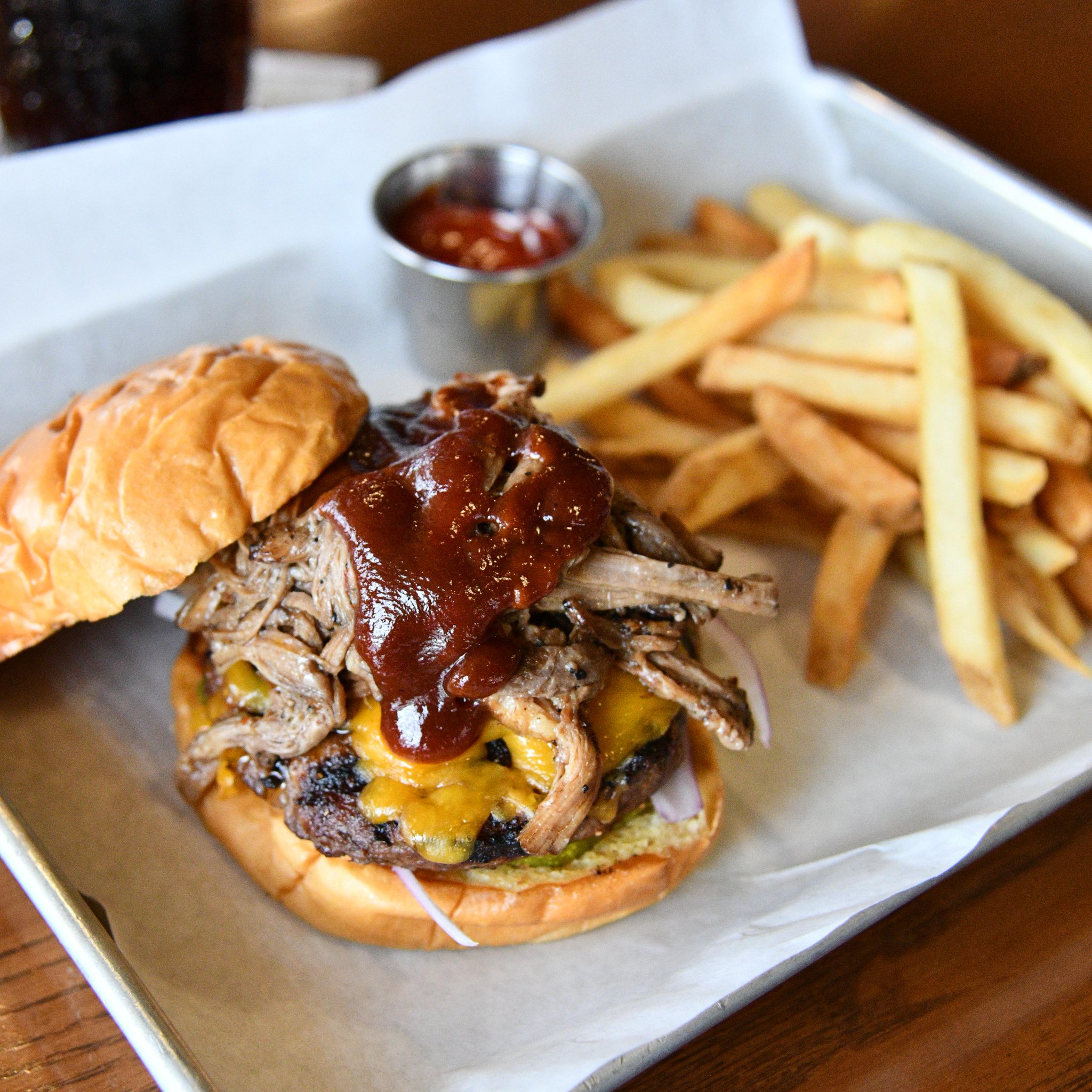 Peaky Blinders Manchester - Peaky Signature Burger ⁠ Ground brisket &  chunk steak patty, golden caramelised onions, black wax cheddar, shredded  lettuce and Peaky burger sauce. Perfectly paired with a cold pint