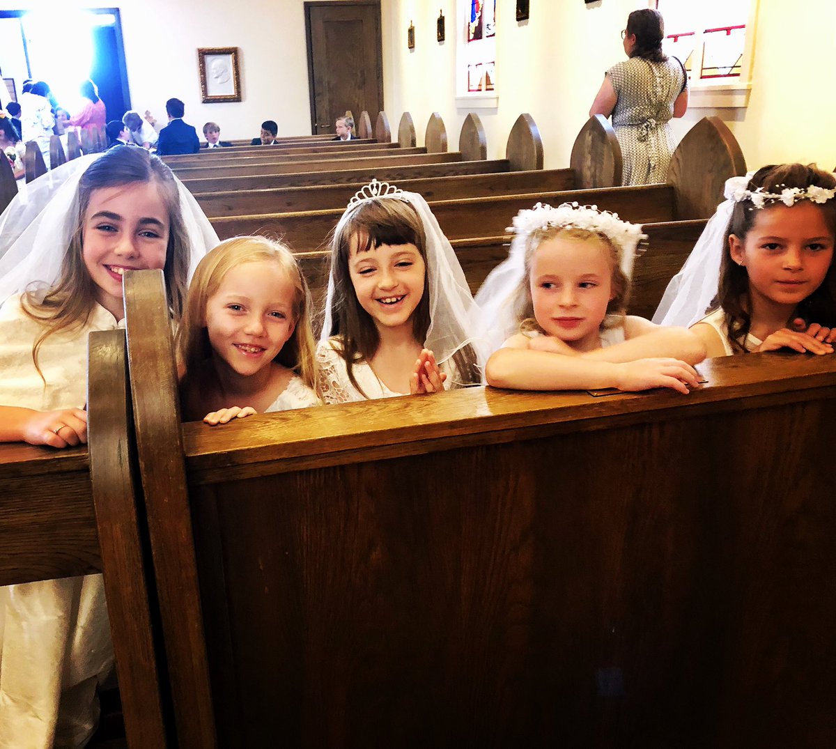 My little sweetie getting ready for first Communion! (She’s the princess in the middle)