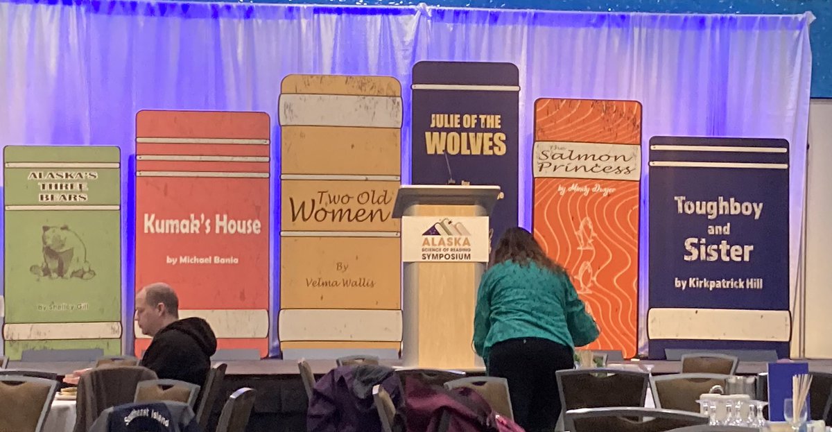 Lesameath1's tweet photo. Nifty backdrop for a reading symposium, but we are on unceded Native lands. Need to check w librarian when selecting titles or @debreese American Indians in Children's Literature (AICL): Not Recommended: JULIE OF THE WOLVES by Jean Craighead George
 #AKSORS #AKREADS @AlaskaDEED https://t.co/86XpYKhdHd