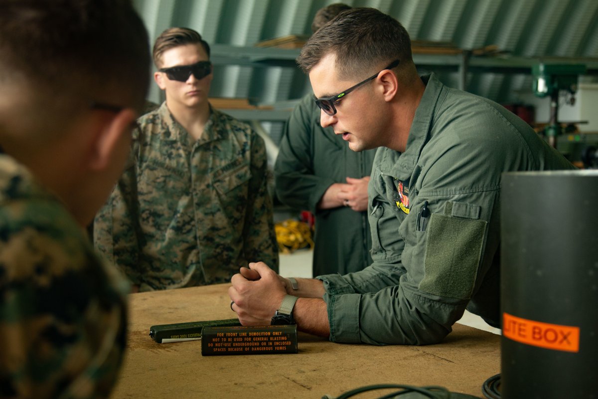 DeptofWar's tweet photo. Fiery display. 
@USMC Marines receive training from explosive ordnance disposal technicians and observe a “wall of fire” demonstration at Marine Corps Air Station Beaufort, S.C. https://t.co/BHtllngxPg