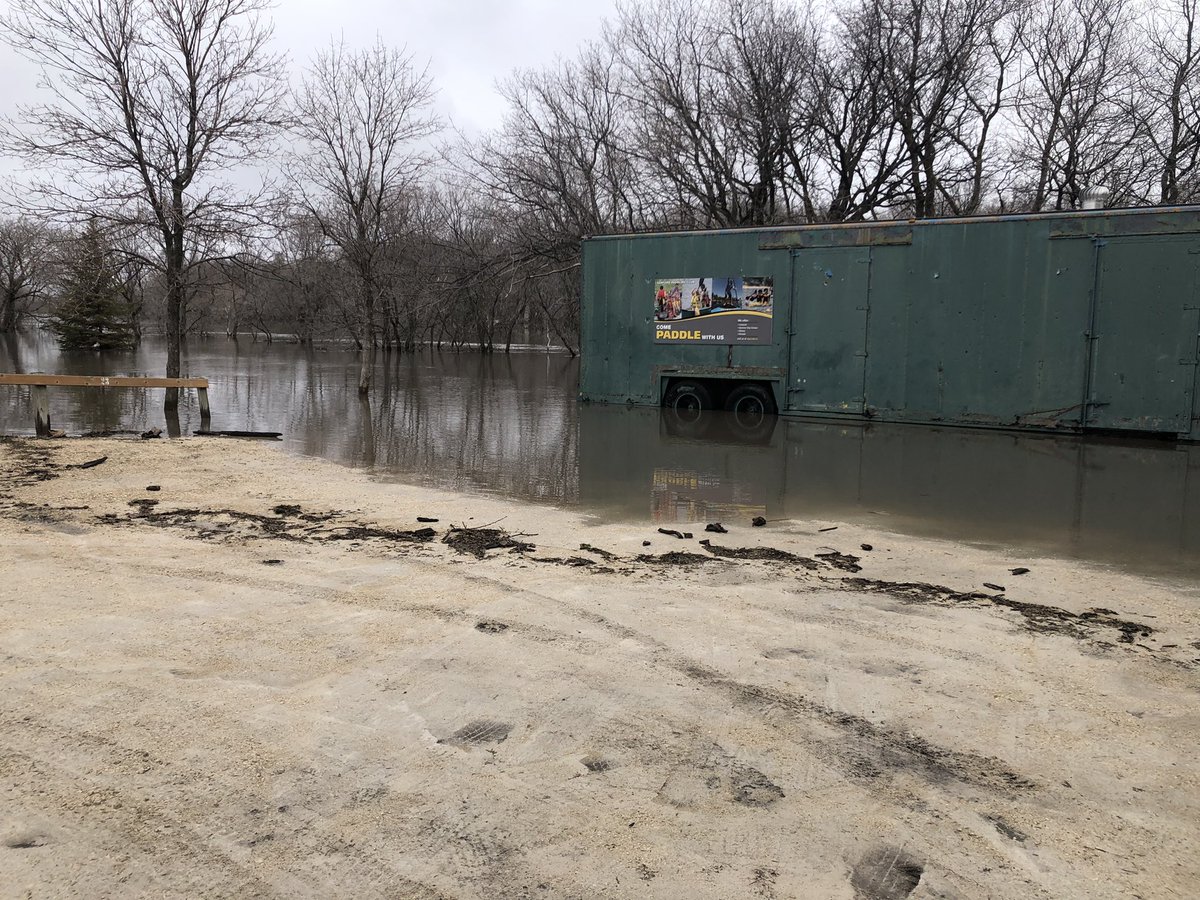 drewkroeker's tweet photo. Water getting high in Sanford, MB. (La Salle River and student parking lot) https://t.co/Ff7hy8oMmC